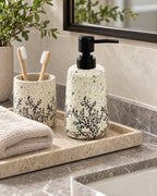 White Soap Dispenser, Speckled Ceramic, Black Pump, 11 oz styled on a tray with bathroom accessories